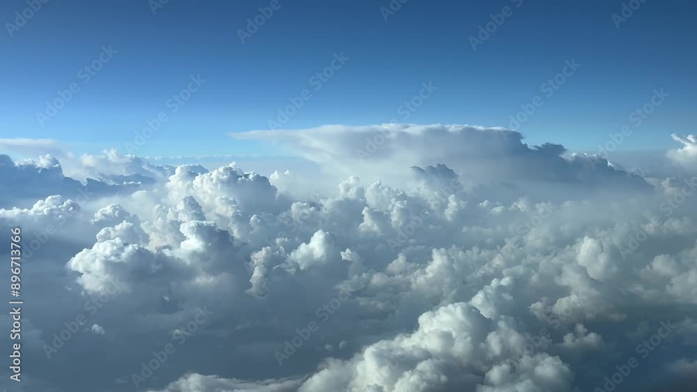 A turbulent sky plenty of stormy clouds as seen by the pilot of a jet flying at cruise level. 4K 60FPS A turbulent sky plenty of stormy clouds as seen by the pilot of a jet flying at cruise level. 4K 60FPS