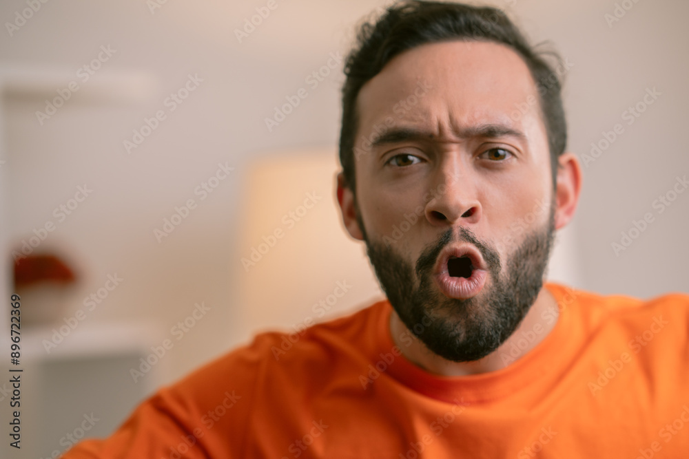 Young bearded man showing astonishment expression Young bearded man showing astonishment expression