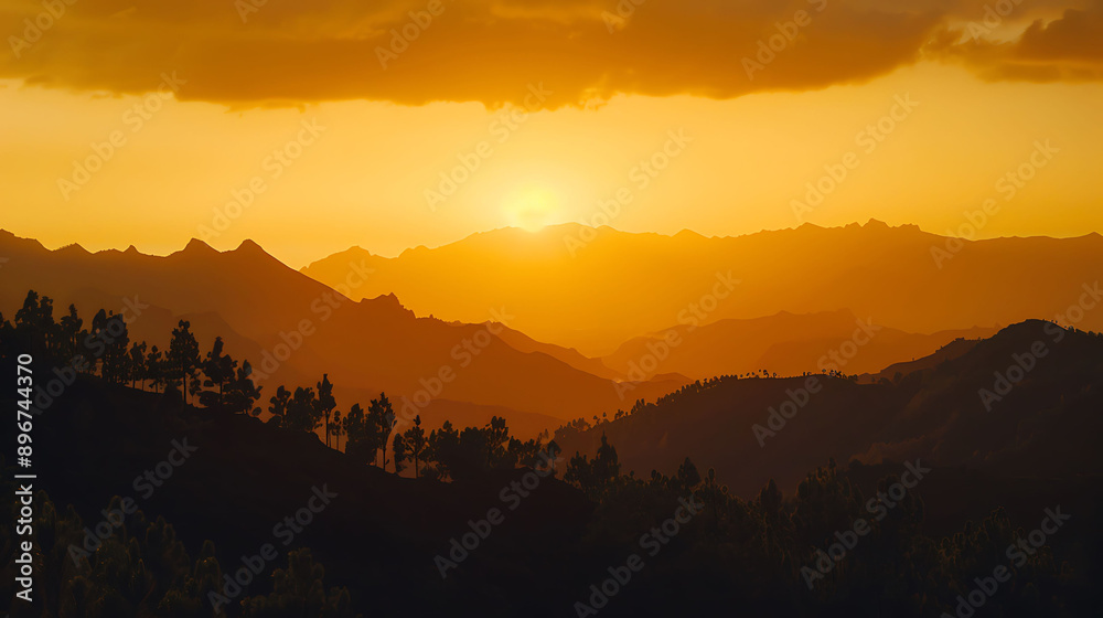 Sunset Over Silhouetted Mountain Range With Trees in Foreground Sunset Over Silhouetted Mountain Range With Trees in Foreground