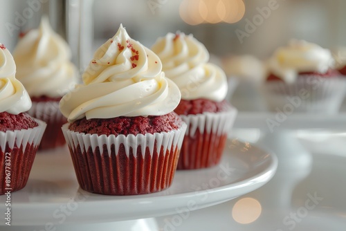 A decadent chocolate cake topped with whipped cream and sprinkles, surrounded by mini cupcakes, offering a delightful, sweet dessert experience in every bite.