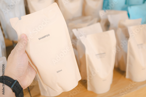 Customer choosing Refill packet. Zero waste. Reuse reduce recycle concept. refill liquid soap, shampoo and other products. Sustainable lifestyle. photo