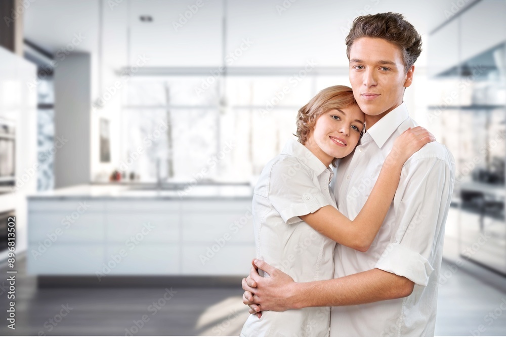 Portrait of happy family couple standing at home Portrait of happy family couple standing at home