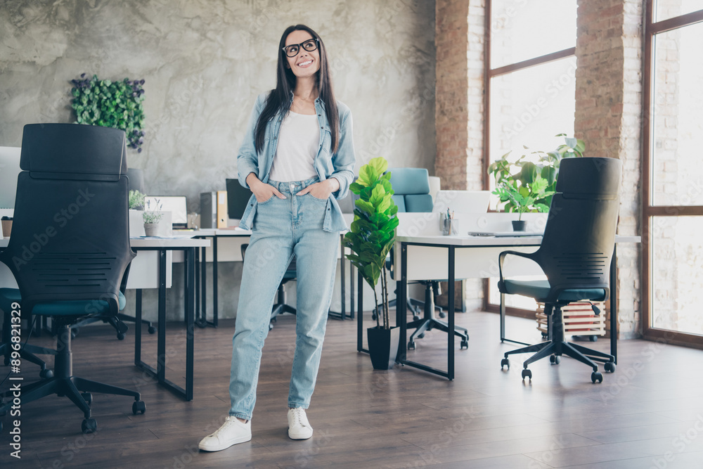 Photo of smiling cheerful lady accountant dressed denim jacket working indoors workplace workstation loft Photo of smiling cheerful lady accountant dressed denim jacket working indoors workplace workstation loft