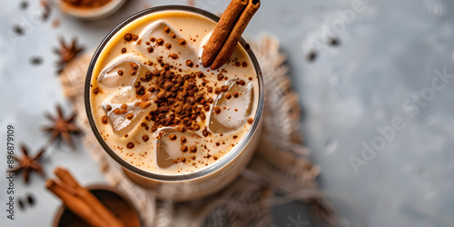 Iced chai latte served with cinnamon stick photo