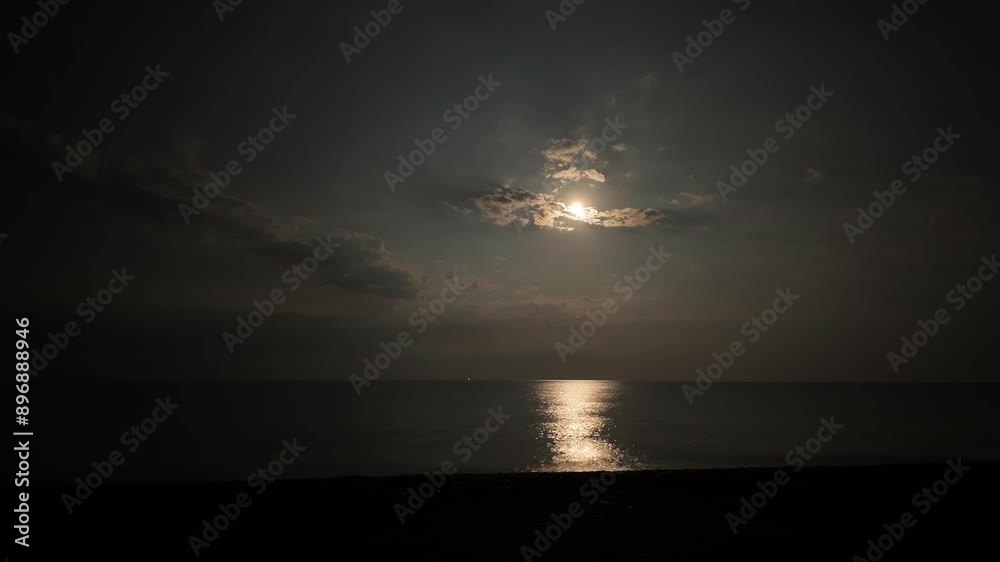 Time-lapse video of the moon moving across the sky over the Black Sea in Crimea, Russia.
