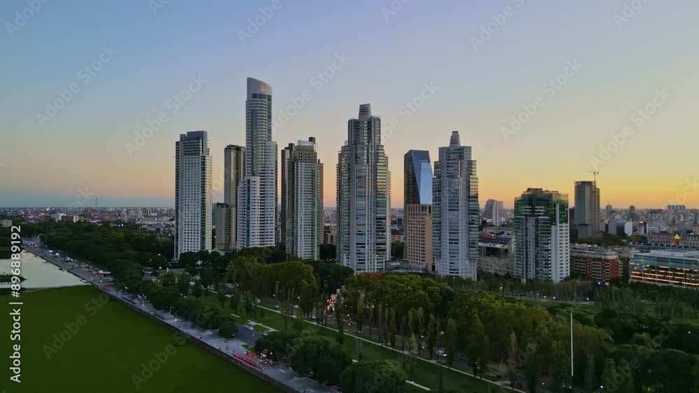 Aerial drone view from the ecological reserve in Puerto Madero with a view of the buildings and sunset colors in the city of Buenos Aires, Argentina. Architecture and Tourism in the city. Aerial drone view from the ecological reserve in Puerto Madero with a view of the buildings and sunset colors in the city of Buenos Aires, Argentina. Architecture and Tourism in the city.