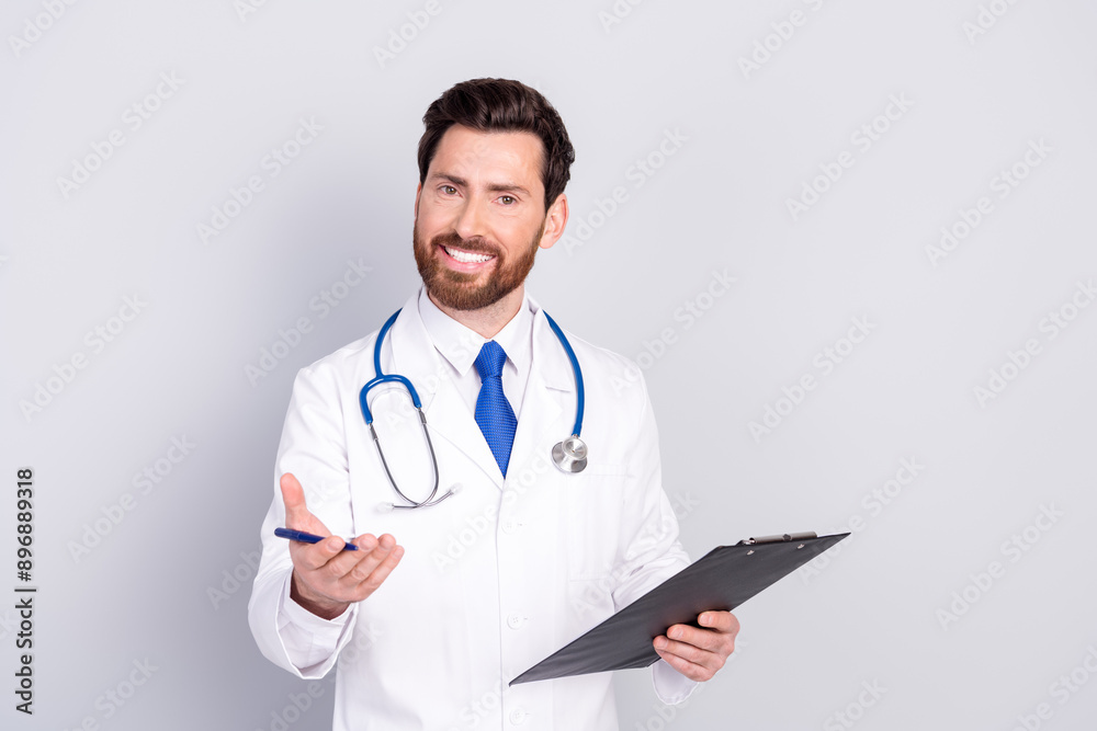 Photo of handsome doctor in uniform hold checklist announce diagnosis isolated on grey color background
