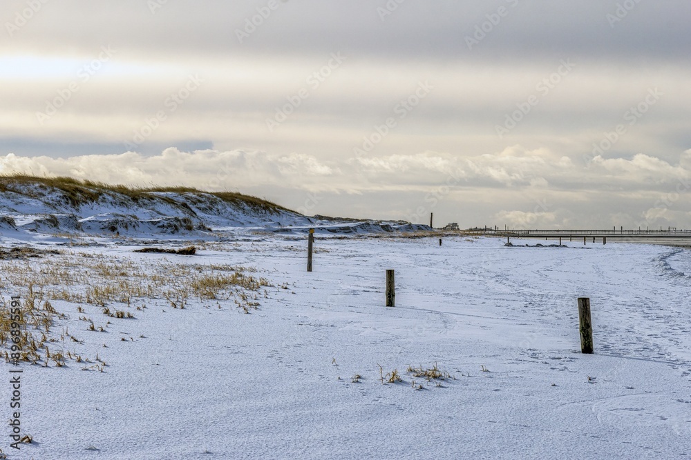 snow covered North Sea beach in Saint Peter Ording