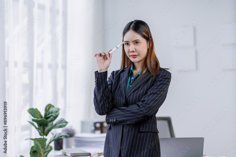 Young busy happy business asian woman employee, young female corporate executive holding digital phone standing at work. 