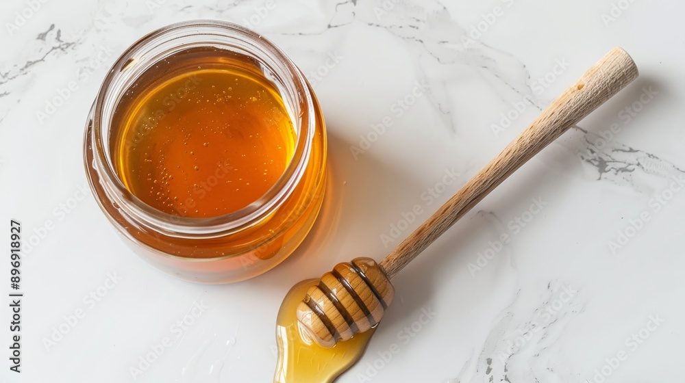 Jar of Manuka Honey with Wooden Dipper on Marble Surface, Perfect for Health, Beauty, and Culinary Uses