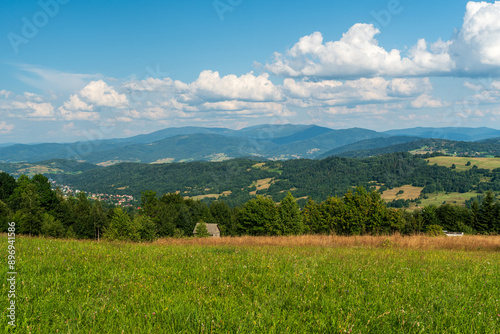 Beskid Zywiecki mountains from meadow bellow Tyniok hill summit in Beskid Slaski mountains in Poland photo