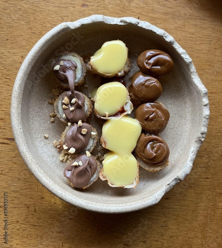 Various sweets in a rustic broken bowl, food and diet.