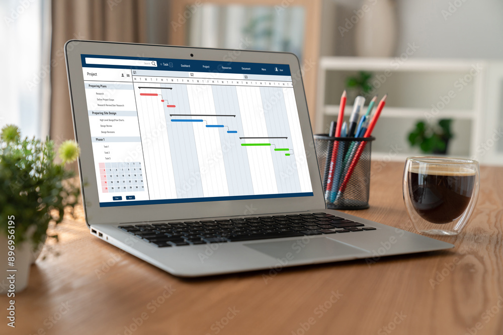 Fototapeta premium Project planning software for modish business project management on the computer screen showing timeline chart of the team project