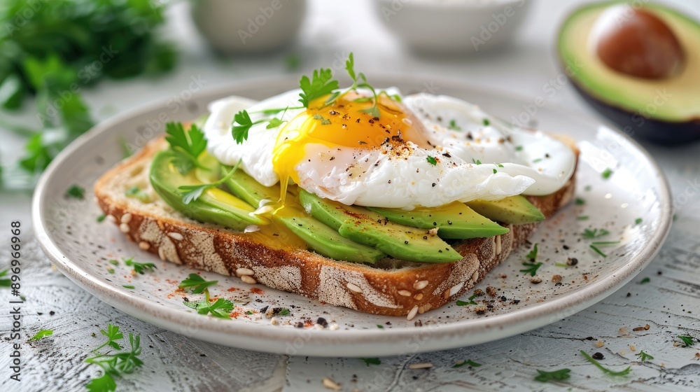 Poached egg on avocado toast. This image shows a healthy and delicious breakfast option perfect for food blogs or recipes. Poached egg on avocado toast. This image shows a healthy and delicious breakfast option perfect for food blogs or recipes.
