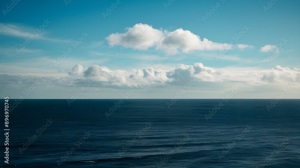 Fototapeta premium A vast blue sky dotted with soft, fluffy seemingly endless sea. Infinite space, ocean horizon