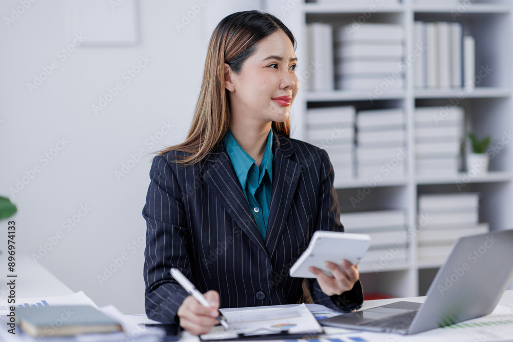 Business, finance and accounting concept. Business asian woman using calculator to calculate financial report, data analysis, graph growth chart, business planning, strategy and investment Business, finance and accounting concept. Business asian woman using calculator to calculate financial report, data analysis, graph growth chart, business planning, strategy and investment