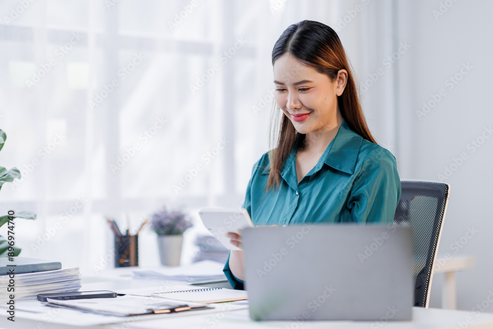 Business, finance and accounting concept. Business asian woman using calculator to calculate financial report, data analysis, graph growth chart, business planning, strategy and investment Business, finance and accounting concept. Business asian woman using calculator to calculate financial report, data analysis, graph growth chart, business planning, strategy and investment