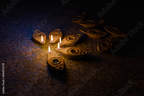 Obraz na płótnie Oil lamps shining in the night, other lamps out of oil