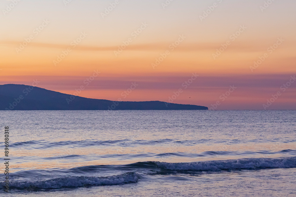 Fototapeta premium orange-purple sky over the sea after sunset