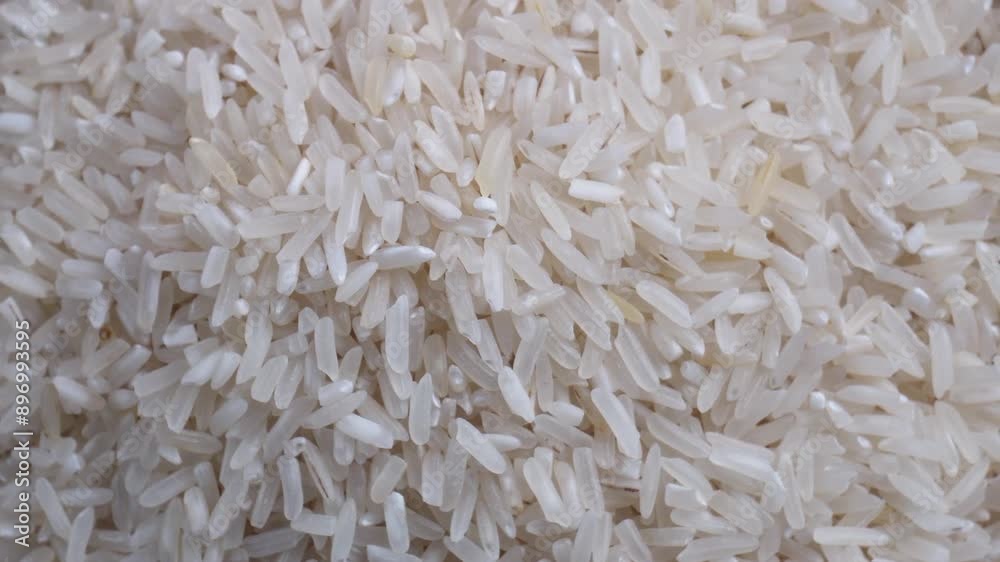 top view close up shot of pile of spinning white rice top view close up shot of pile of spinning white rice