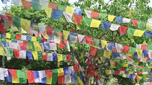 Prayer flags hanging on the tree in Swayambhunath temple, Nepal.