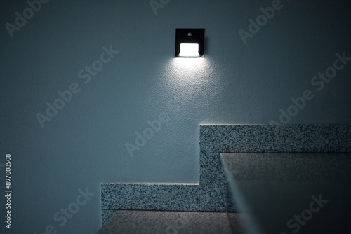 Illumination of steps with lamps with motion sensors.  Illumination of the corridor with small bulbs.