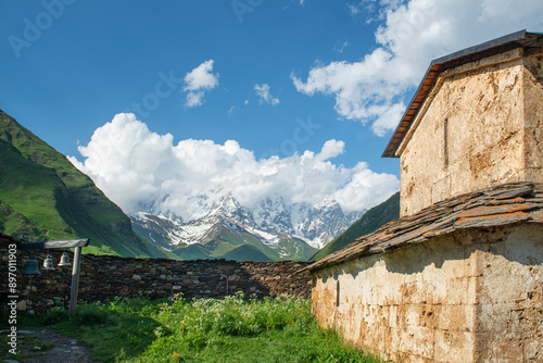 Ushguli village. Lamaria Church Jgrag and Ushguli village at the foot of Mt. Shkhara,Upper Svaneti, Georgia. photo