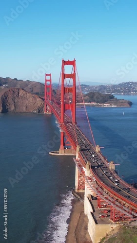 Vertical Drone Shot of Golden Gate Bridge, San Francisco, California USA, Traffic and Bay on Sunny Day photo