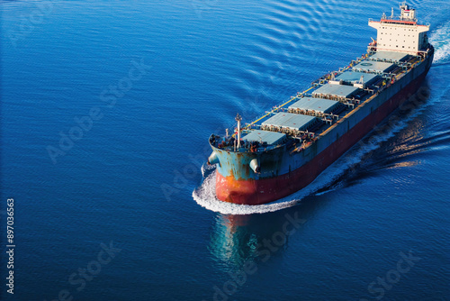 Bulk carrier or bulker underway in sea, ship for unpackaged bulk dry cargo