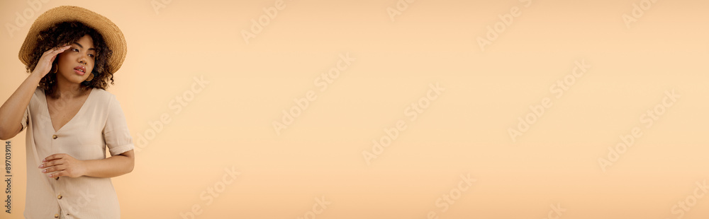 Beautiful African American woman with curly hair wearing a white dress and straw hat in a studio setting. Beautiful African American woman with curly hair wearing a white dress and straw hat in a studio setting.