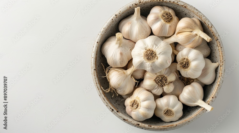 a bowl filled with fresh garlic. empty space for your text a bowl filled with fresh garlic. empty space for your text