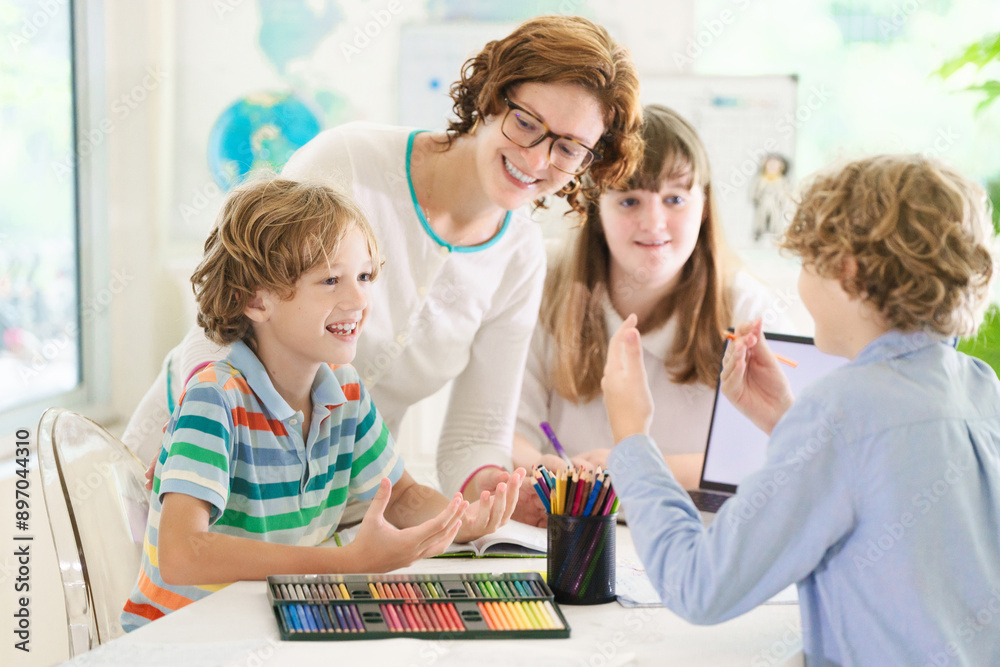 Fototapeta premium Back to school. Kids and teacher in classroom