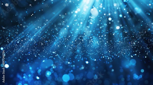 Blue Light Rays. Abstract Background with Sparkling Particles for Christmas and New Year Celebration