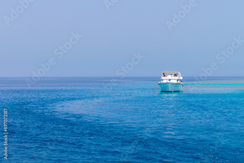 Luxury boat yachting sailing in blue sea,landscape of ship in calm open ocean.Summer holidays