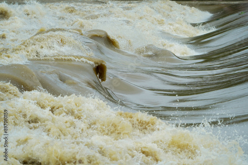 Powerful River Rapids Flowing Nature Water Dynamics Stock Photo, Dynamic River Waves and Turbulence Natural Waterforce, Swirling River Currents and Waves Energetic Water Motion. photo