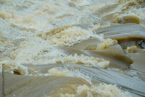 Powerful River Rapids Flowing Nature Water Dynamics Stock Photo, Dynamic River Waves and Turbulence Natural Waterforce, Swirling River Currents and Waves Energetic Water Motion.