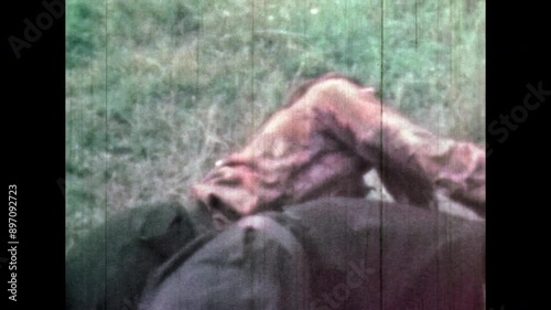 Enemy killing opponent with knife in fist fight. Cinematic death. Two men in dramatic fight outdoor. Close up, tension struggle. Brutal attack. Man stabbing repeatedly. Vintage film. Retro archive