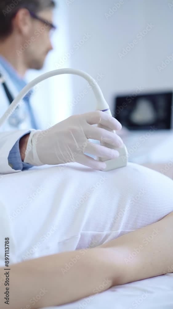 Doctor man is using ultrasound machine to examine internal organs of a patient woman. Female mammary gland health, cancer prevention. Medicine Doctor man is using ultrasound machine to examine internal organs of a patient woman. Female mammary gland health, cancer prevention. Medicine