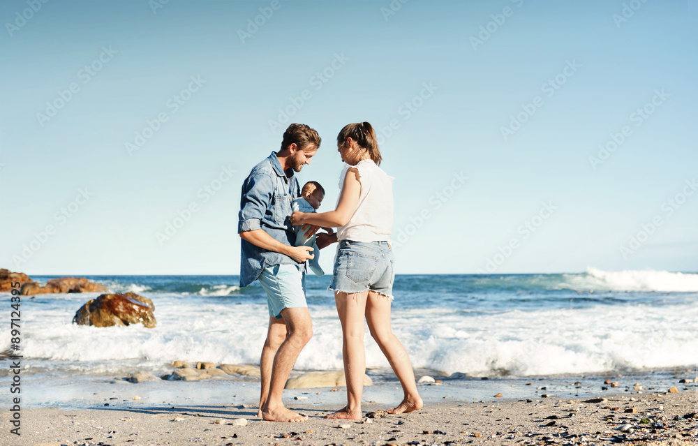 Dad, mother or baby at beach for bonding, holiday or travel in Portugal with boy or family memory. Parents, mom or father with infant at sea for vacation trip together for wellness or nature to relax Dad, mother or baby at beach for bonding, holiday or travel in Portugal with boy or family memory. Parents, mom or father with infant at sea for vacation trip together for wellness or nature to relax