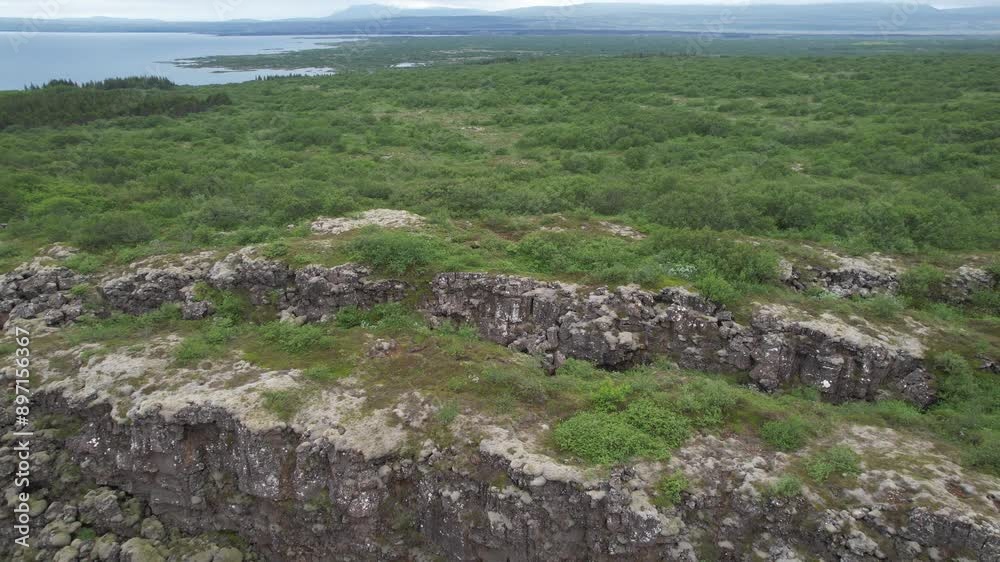 aerial drone shot of viewpoint over rocks formation in iceland in cloudy summer aerial drone shot of viewpoint over rocks formation in iceland in cloudy summer