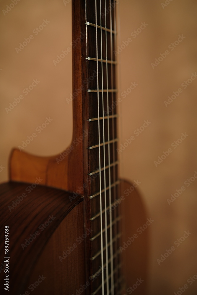Close up, cinematic, classical guitar at studio textured background. Guitar neck,playing chord, Close up, cinematic, classical guitar at studio textured background. Guitar neck,playing chord,