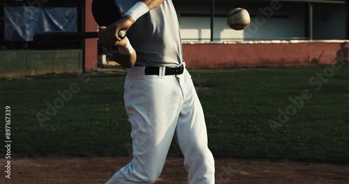 Super slow motion close up of baseball player batter hitting baseball ball with bat during competition game match on baseball stadium at 1000 fps.