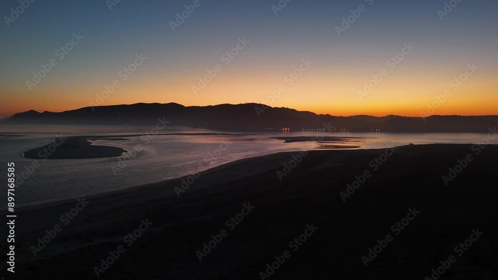 Aerial view of Troia Peninsula, Setubal, Portugal with Arrabida Mountains in background at sunset Aerial view of Troia Peninsula, Setubal, Portugal with Arrabida Mountains in background at sunset