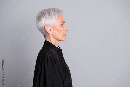 Profile side photo of judge old woman look empty space wear black robe isolated pastel color background