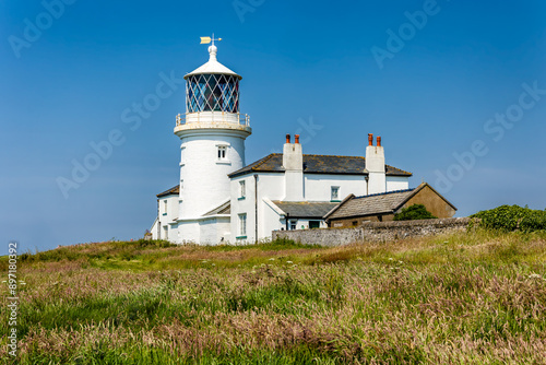 1800s Trinity Lighthouse on the small island of Caldey off the Pembrokeshire coast, Wales photo