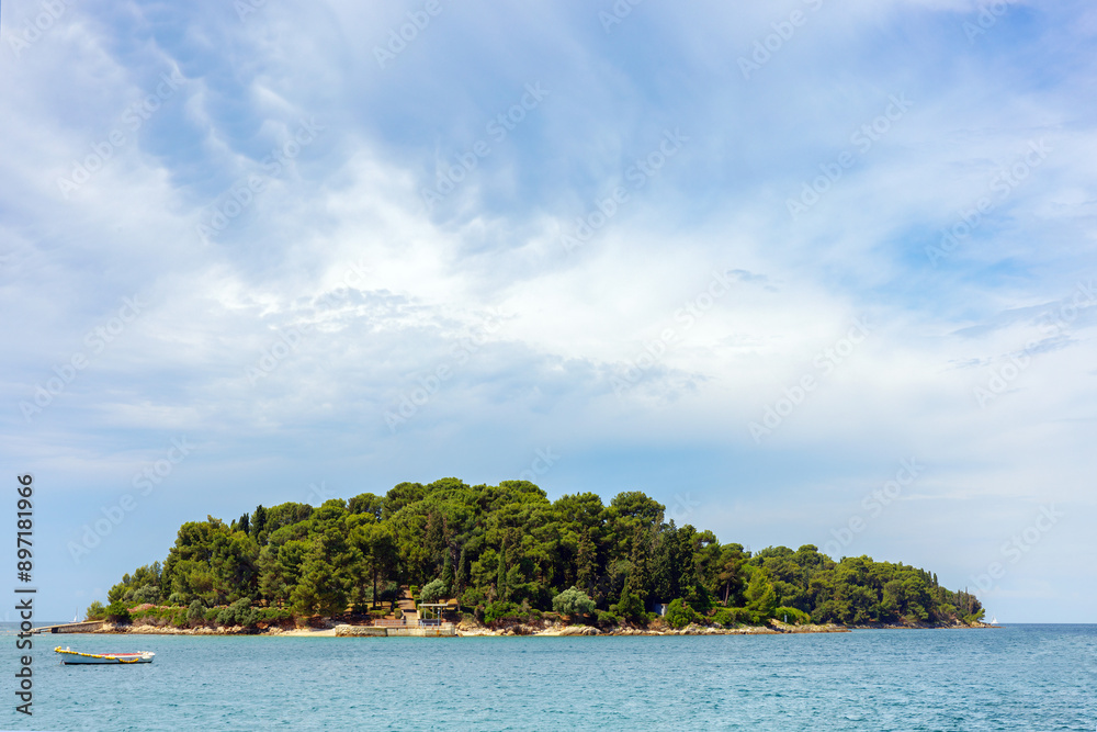 The island of Spilja Grotta, near the Istrian town of Rovinj, Croatia, Europe, space for text, blue summer sky The island of Spilja Grotta, near the Istrian town of Rovinj, Croatia, Europe, space for text, blue summer sky