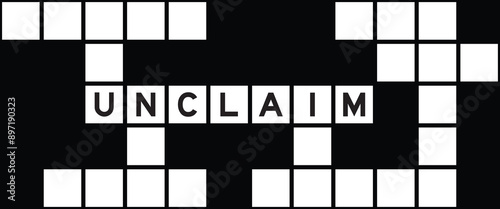 Alphabet letter in word unclaim on crossword puzzle background