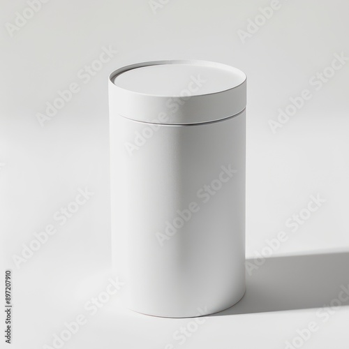 A white cylindrical box placed on a white background, illustrating its pure, modern design with a focus on minimalism and elegance