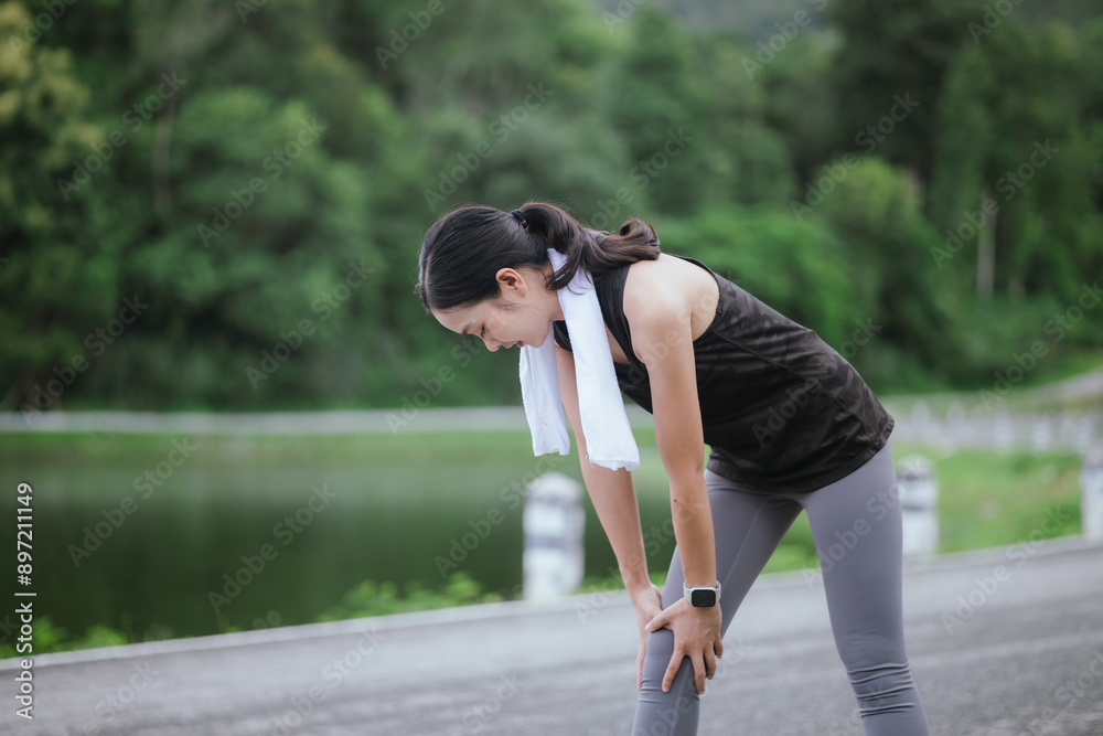 A young, beautiful Asian woman runs happily in a city park on a summer morning. Embracing an active lifestyle, she enjoys outdoor exercise, showcasing fitness, health, vitality, and a joyful, healthy A young, beautiful Asian woman runs happily in a city park on a summer morning. Embracing an active lifestyle, she enjoys outdoor exercise, showcasing fitness, health, vitality, and a joyful, healthy