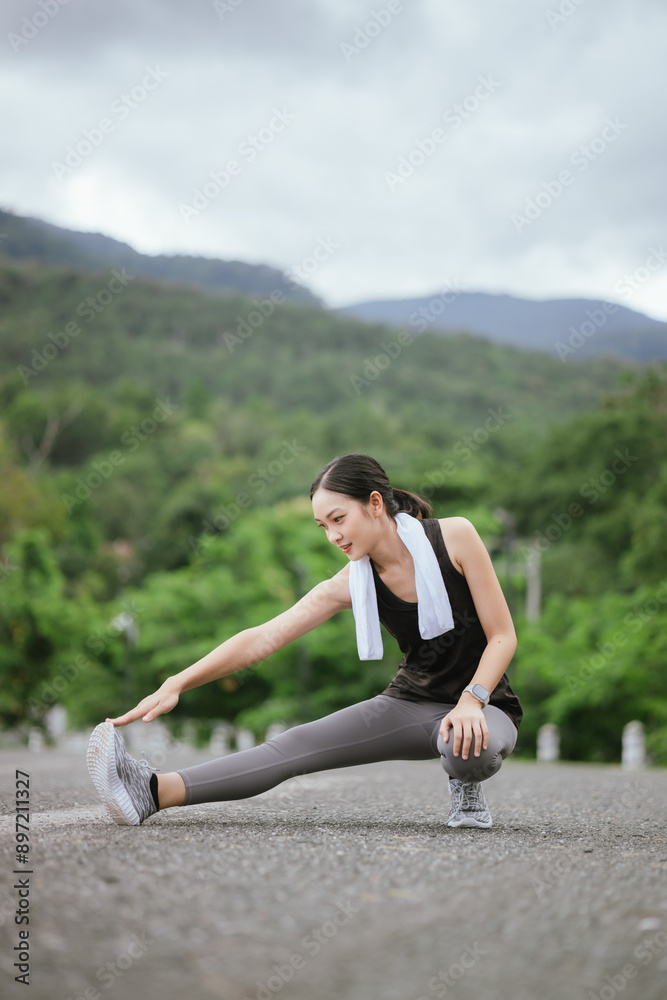 A young, beautiful Asian woman runs happily in a city park on a summer morning. Embracing an active lifestyle, she enjoys outdoor exercise, showcasing fitness, health, vitality, and a joyful, healthy A young, beautiful Asian woman runs happily in a city park on a summer morning. Embracing an active lifestyle, she enjoys outdoor exercise, showcasing fitness, health, vitality, and a joyful, healthy